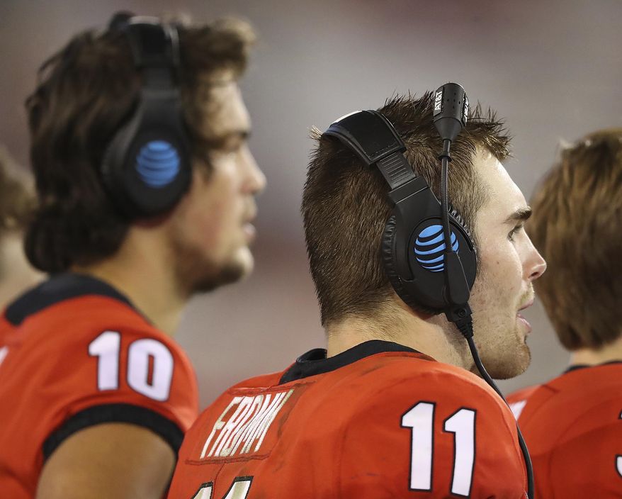 Georgia quarterbacks Jacob Eason, left, who is injured, and current starter Jake Fromm watch during the fourth quarter against Samford from the sidelines during the team's 42-14 victory in an NCAA college football game Saturday, Sept. 16, 2017, in Athens, Ga. (Curtis Compton/Atlanta Journal-Constitution via AP)