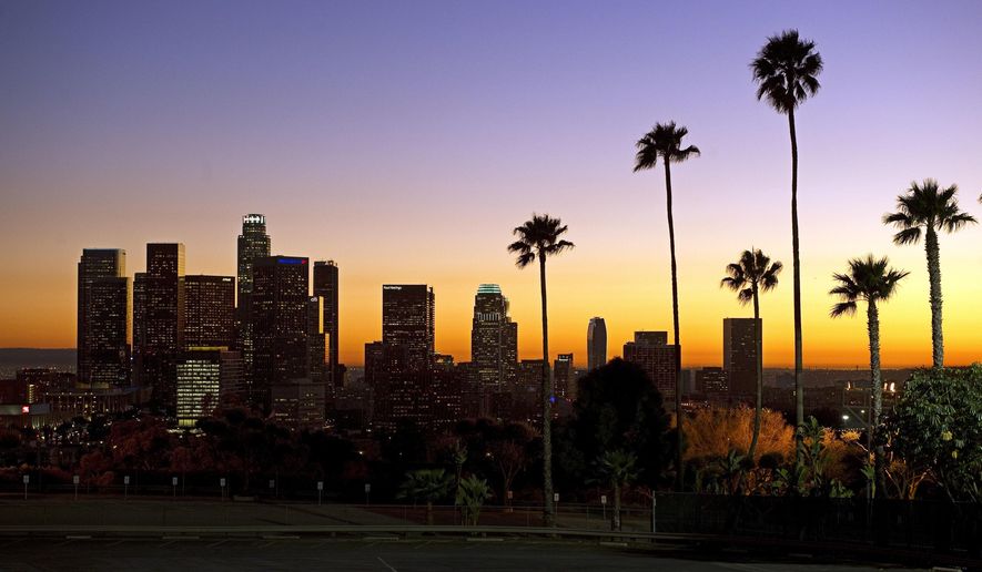 FILE - In this Jan. 21, 2011, file photo, the sun sets beyond the Los Angeles skyline, as seen from Dodger Stadium in Los Angeles. The U.S. Geological Survey said a magnitude-3.6 quake hit at about 11:20 p.m. on Monday, Sept. 18, 2017, Its epicenter was about 3.6 miles (6 kilometers) northwest of Westwood, California. While the quake wasn’t big enough to cause much damage, the USGS says dozens of people in the Los Angeles area reported feeling the tremor. (AP Photo/Mark J. Terrill, File)
