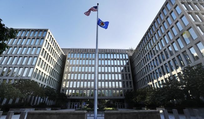 The U.S. Office of Personnel Management is photographed Tuesday, Sept. 6, 2016, in Washington. It was time to purge the hacker from the U.S. government’s computers. After secretly monitoring the hacker&#x27;s online movements for months, officials worried he was getting too close to critical information and devised a plan to expel him. Trouble was, with all their attention focused in that case, they missed the other hacker entirely. A new congressional report provides previously undisclosed details and a behind-the-scenes chronology of one of the worst-ever cyberattacks on the United States, laying out missed opportunities before the break-in at the OPM exposed security clearances, background checks and fingerprint records. (AP Photo/Jacquelyn Martin)