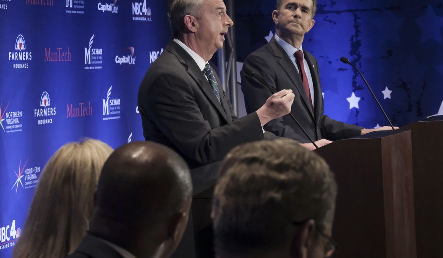 Virginia gubernatorial candidates Republican Ed Gillespie (left) and Democrat Lt. Gov. Ralph Northam debate in McLean, Va., on Sept. 19, 2017. The two major party candidates in Virginia's closely watched race for governor argued in mostly cordial tones Tuesday over taxes, President Donald Trump and what Virginia should do with its numerous monuments to the Confederacy. (Bonnie Jo Mount/The Washington Post via AP, Pool)