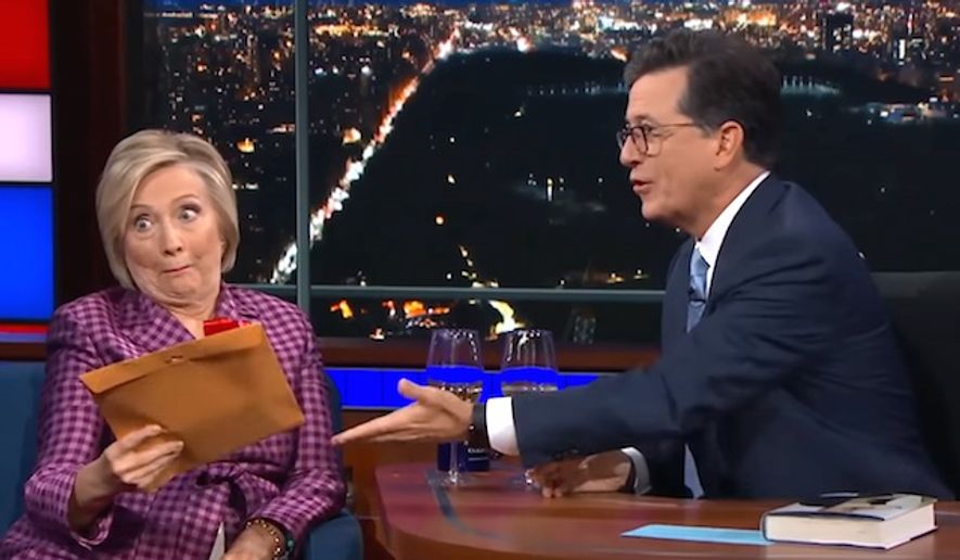 Former Secretary of State Hillary Clinton reacts on Sept. 19, 2017, as she is presented with unused jokes from Stephen Colbert&#39;s 2016 election special on Showtime. (Image: YouTube, &quot;The Late Show with Stephen Colbert&quot;)