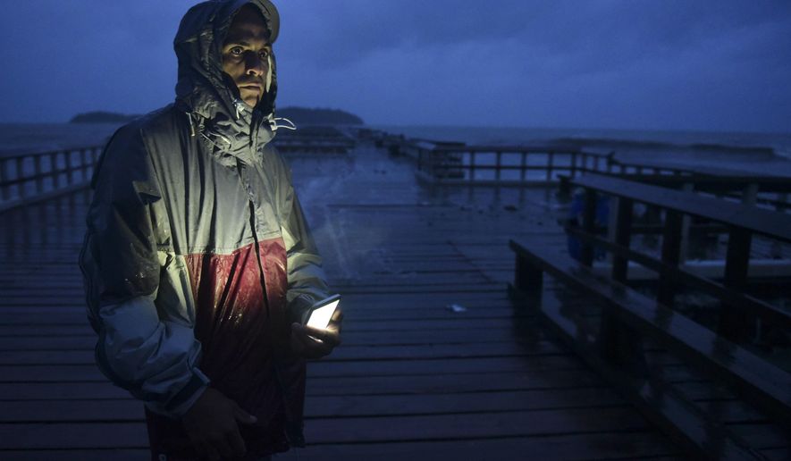 David Cruz Marrero watches the waves at Punta Santiago pier hours before the imminent impact of Maria, a Category 5 hurricane that threatens to hit the eastern region of the island with sustained winds of 165 miles per hour, in Humacao, Puerto Rico, Tuesday, September 19, 2017. (AP Photo/Carlos Giusti)