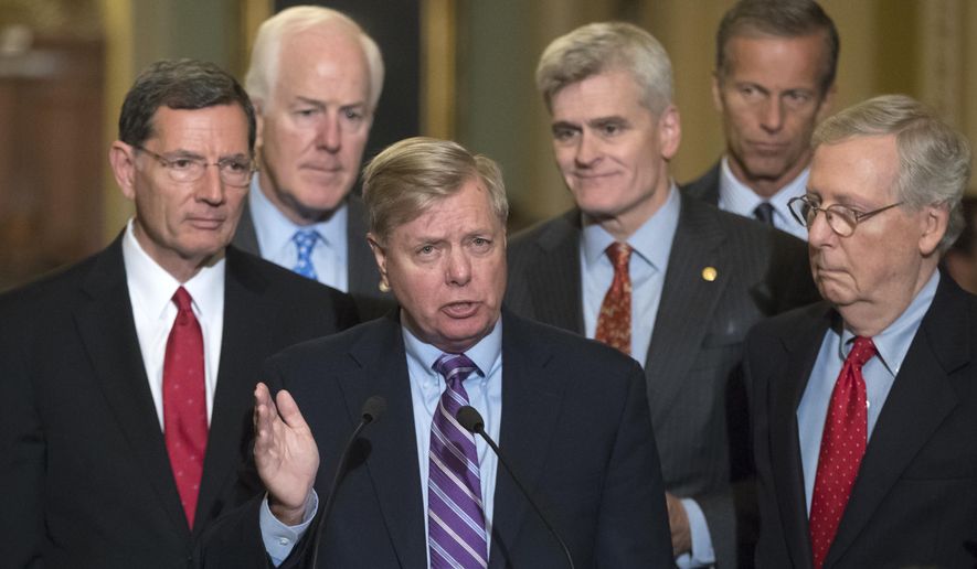 Sen. Lindsey Graham, R-S.C., joined by, from left, Sen. John Barrasso, R-Wyo., Majority Whip John Cornyn, R-Texas, Sen. Bill Cassidy, R-La., Sen. John Thune, R-S.D., and Senate Majority Leader Mitch McConnell, R-Ky., speaks to reporters as he pushes a last-ditch effort to uproot former President Barack Obama&#39;s health care law, at the Capitol in Washington, Tuesday, Sept. 19, 2017. (AP Photo/J. Scott Applewhite)