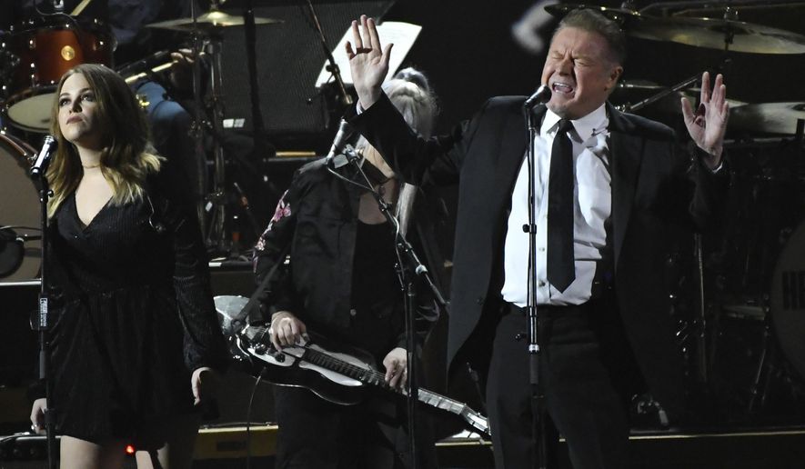 CORRECTS DATE OF ANNOUNCEMENT TO TUESDAY, SEPT. 19 INSTEAD OF WEDNESDAY, SEPT. 20 - FILE - In this Friday, Feb. 10, 2017, file photo, Don Henley performs "Free Fallin" at the MusiCares Person of the Year tribute at the Los Angeles Convention Center. Henley, Lyle Lovett and Clint Black are the latest musicians planning a concert to raise money for victims of Harvey. The trio on Tuesday, Sept. 19 announced a Nov. 28 show at Bass Hall in Fort Worth, Texas. (Photo by Chris Pizzello/Invision/AP, File)