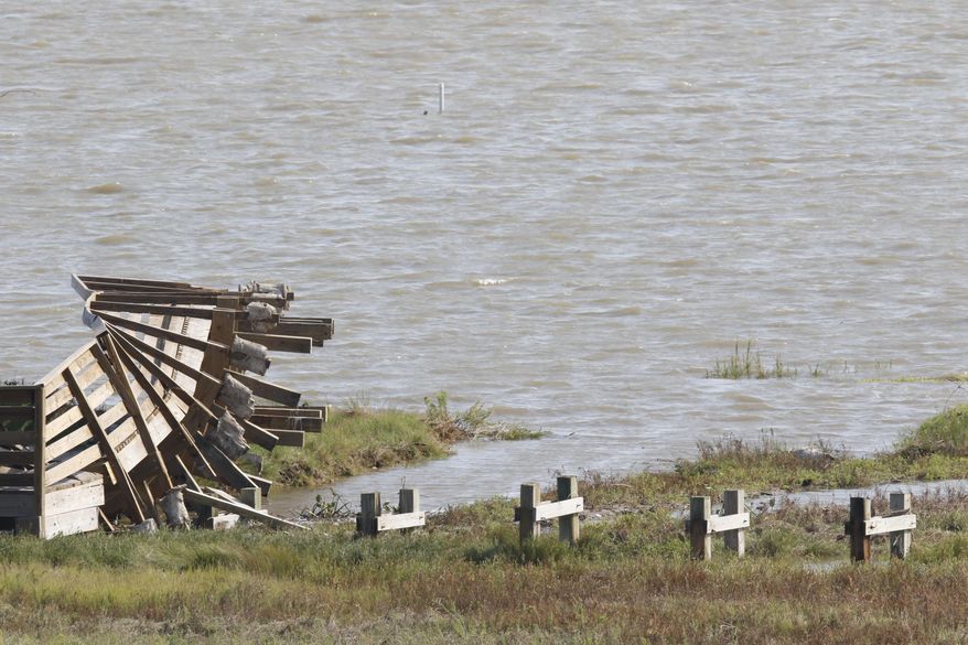 This Sept. 9, 2017 photo shows, a pier which was ripped up by Hurricane Harvey at the Aransas National Wildlife Refuge in Austwell, Texas. Hurricane Harvey damaged the refuge and staff are trying to get it in shape before the endangered whooping cranes and rare sea turtles return to nest. (Irwin Thompson/The Dallas Morning News via AP)