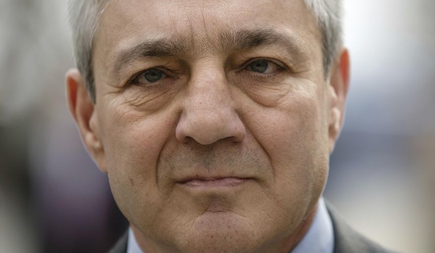 FILE - In this Friday, March 24, 2017, file photo, former Penn State president Graham Spanier walks from the Dauphin County Courthouse in Harrisburg, Pa. A defamation lawsuit filed by Spanier against former FBI director Louis Freeh has been thrown out. Spanier sued Freeh over a 2012 report he issued on Penn State&#39;s handling of the Jerry Sandusky child sexual abuse scandal. (AP Photo/Matt Rourke, File)