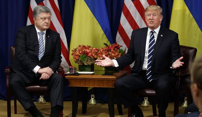 President Donald Trump meets with Ukraine&#x27;s President Petro Poroshenko at the Palace Hotel during the United Nations General Assembly, Thursday, Sept. 21, 2017, in New York. (AP Photo/Evan Vucci/File)