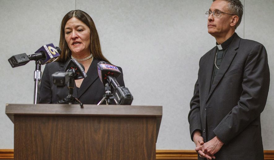 FILE – In this March 6, 2017 file photo, acting U.S. Attorney Soo Song, left, joined by Bishop Mark Bartchak, right, of the Diocese of Altoona-Johnstown, discusses new measures to protect children in the Pennsylvania diocese from sexual abuse and better assist victims, during a news conference in Johnstown, Pa. The Diocese of Altoona-Johnstown has appointed a five-member board to oversee its handling of child sex abuse allegations against clergy, as part of the March 2017 agreement between Bartchak and Song, the federal prosecutor who oversees western Pennsylvania. (Andrew Rush/Pittsburgh Post-Gazette via AP, File)