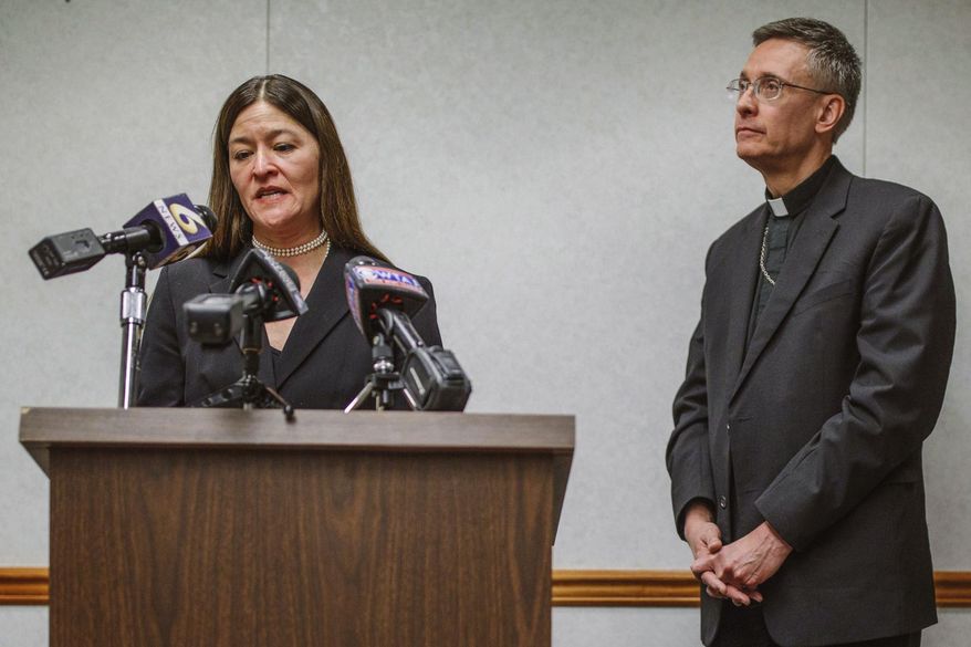 FILE – In this March 6, 2017 file photo, acting U.S. Attorney Soo Song, left, joined by Bishop Mark Bartchak, right, of the Diocese of Altoona-Johnstown, discusses new measures to protect children in the Pennsylvania diocese from sexual abuse and better assist victims, during a news conference in Johnstown, Pa. The Diocese of Altoona-Johnstown has appointed a five-member board to oversee its handling of child sex abuse allegations against clergy, as part of the March 2017 agreement between Bartchak and Song, the federal prosecutor who oversees western Pennsylvania. (Andrew Rush/Pittsburgh Post-Gazette via AP, File)