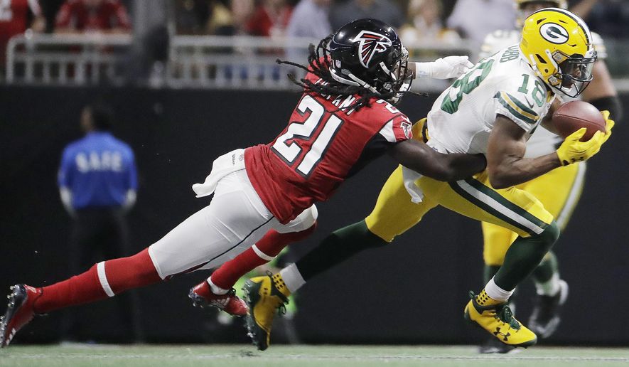 FILE - In this Sunday, Sept. 17, 2017, file photo, Green Bay Packers wide receiver Randall Cobb (18) makes the catch as Atlanta Falcons cornerback Desmond Trufant (21) closes in during the first of an NFL football game in Atlanta. Trufant is playing at full capacity after missing the Falcons&#39; playoff run last year with a torn pectoral he suffered in November. The 2015 Pro Bowl cornerback says he&#39;s making up for lost time. (AP Photo/David Goldman), File)
