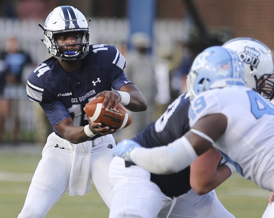 In this Saturday, Sept. 16, 2017 photo, Old Dominion quarterback Steven Williams Jr. takes a snap during an NCAA college football game against North Carolina in Norfolk, Va. Old Dominion coach Bobby Wilder was looking for an offensive spark when he sent 17-year-old freshman Steven Williams Jr. into last weekend's game against North Carolina. What he thinks he found instead is a quarterback. (AP Photo/Jason Hirschfeld, File)