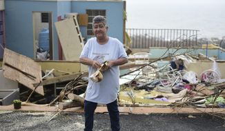 &amp;quot;Whats important is ones life&amp;quot; says Rufina Fernandez standing in front of her daughters ruined house while eating a coconut a day after the impact of Hurricane Maria, in Yabucoa, Puerto Rico, Thursday, September 21, 2017. As of Thursday evening, Maria was moving off the northern coast of the Dominican Republic with winds of 120 mph (195 kph). The storm was expected to approach the Turks and Caicos Islands and the Bahamas late Thursday and early Friday. (AP Photo/Carlos Giusti)