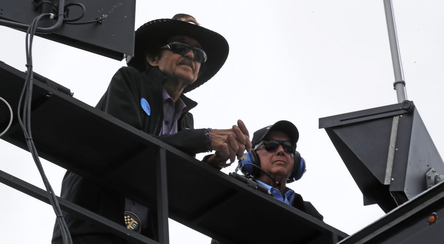 Racing legend Richard Petty, left, watches practice with Roger Penske prior to qualifying for the NASCAR Cup Series 300 auto race at New Hampshire Motor Speedway in Loudon, N.H., Friday, Sept. 22, 2017. (AP Photo/Charles Krupa)
