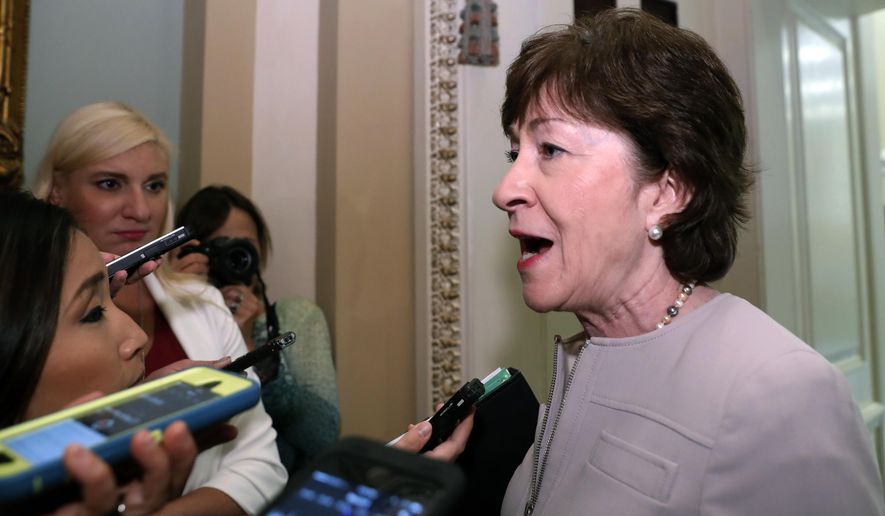 Sen. Susan Collins, R-Maine, speaks with reporters before heading into a policy luncheon on Capitol Hill, Tuesday, Sept. 19, 2017 in Washington. (AP Photo/Alex Brandon)