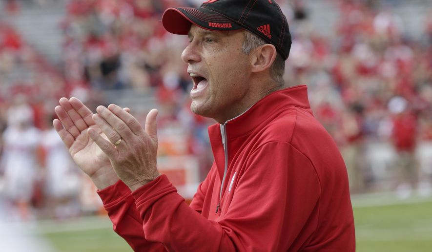 FILE - In this Saturday, April 15, 2017 file photo, Nebraska head coach Mike Riley applauds during the annual NCAA college football Red-White spring game, in Lincoln, Neb. Nebraska plays Rutgers on Saturday, Sept. 23, 2017. (AP Photo/Nati Harnik, File)