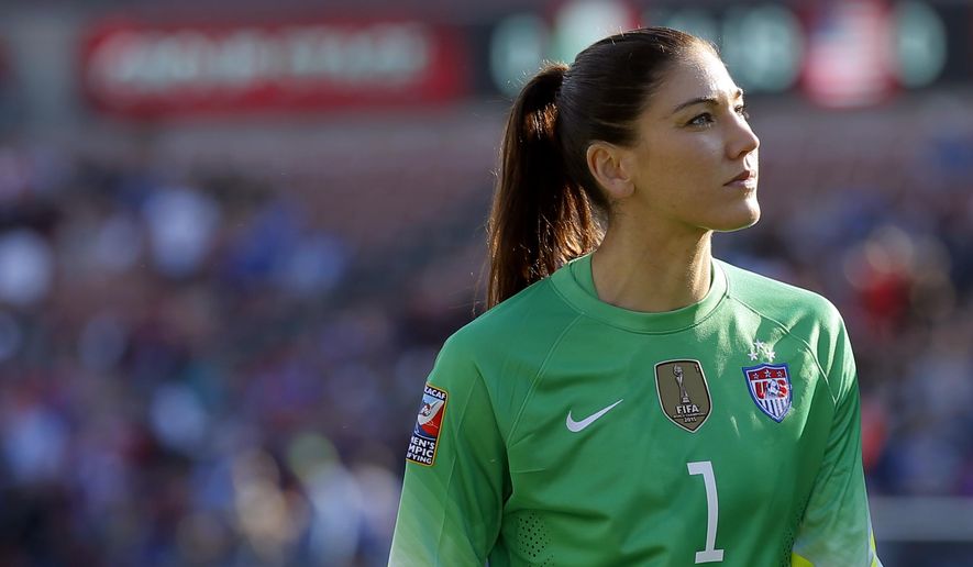 FILE - In this Feb. 13, 2016, file photo, United States goalie Hope Solo walks off the field at half time of a CONCACAF Olympic qualifying tournament soccer match against Mexico in Frisco, Texas. Solo says she&#39;s settled a grievance with U.S. Soccer over her suspension from the women&#39;s national team last year following comments she made at the Rio Olympics. (AP Photo/Tony Gutierrez, File)