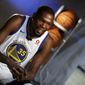 Golden State Warriors&#39; Kevin Durant conducts an interview during NBA basketball team media day Friday, Sept. 22, 2017, in Oakland, Calif. (AP Photo/Marcio Jose Sanchez)