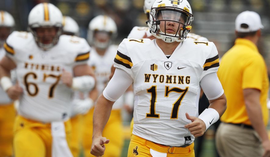 FILE - In this Saturday, Sept. 2, 2017, file photo, Wyoming quarterback Josh Allen (17) runs onto the field before an NCAA college football game against Iowa in Iowa City, Iowa. Allen had a long day against Iowa and it got even worse against Oregon. The Wyoming quarterback&#39;s two big chances to show off his prodigious talents were pretty much a flop, but make no mistake: Allen is still one of the most talented college quarterbacks in the country and a potential high draft pick. (AP Photo/Charlie Neibergall, File)