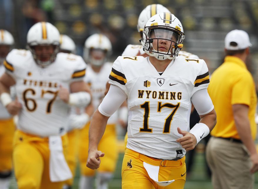 FILE - In this Saturday, Sept. 2, 2017, file photo, Wyoming quarterback Josh Allen (17) runs onto the field before an NCAA college football game against Iowa in Iowa City, Iowa. Allen had a long day against Iowa and it got even worse against Oregon. The Wyoming quarterback&#x27;s two big chances to show off his prodigious talents were pretty much a flop, but make no mistake: Allen is still one of the most talented college quarterbacks in the country and a potential high draft pick. (AP Photo/Charlie Neibergall, File)
