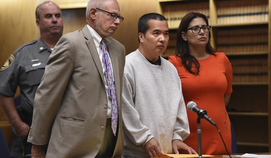 Lishan Wang, center, appears in court with Chief Public Defender Thomas Ullmann, left, during his sentencing at New Haven Superior Court Friday, Sept. 22, 2017 in New Haven, Conn. Wang, convicted of killing a Yale University physician over a workplace dispute has been sentenced to 32 years in prison. The judge handed down the punishment Wang for the 2010 shooting death of Dr. Vajinder Toor. He pleaded no contest in June to manslaughter and other charges. (Brad Horrigan/The Courant via AP)