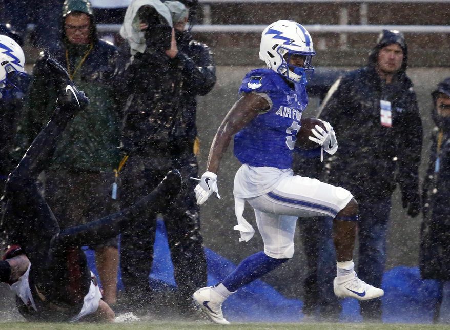 Air Force wide receiver Ronald Cleveland (3) runs through the rain for a touchdown against San Diego State during the first half of an NCAA college football game Saturday, Sept. 23, 2017, at Air Force Academy, Colo. (AP Photo/Jack Dempsey)