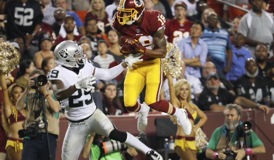 Washington Redskins wide receiver Josh Doctson (18) pulls in a touchdown pass as Oakland Raiders cornerback David Amerson (29) looks back at him during the second half of an NFL football game in Landover, Md., Sunday, Sept. 24, 2017. (AP Photo/Pablo Martinez Monsivais)