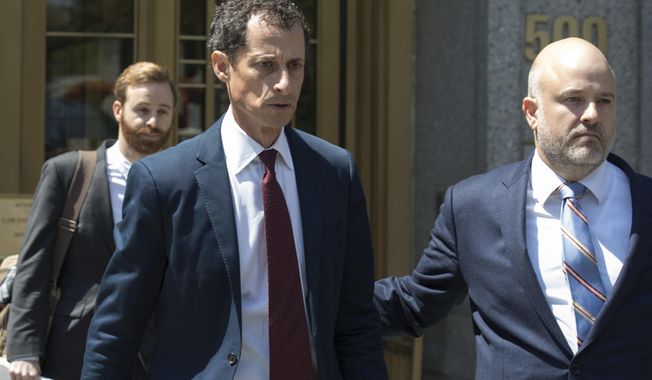 FILE - In this May 19, 2017, file photo, former U.S. Rep. Anthony Weiner, left, leaves Federal court in New York after pleading guilty to a charge of transmitting sexual material to a minor. Weiner is to be sentenced Monday, Sept. 25, 2017, for sending obscene material to a 15-year-old girl in 2016. (AP Photo/Mary Altaffer, File)