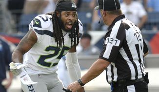 Seattle Seahawks cornerback Richard Sherman (25) argues a penalty call with umpire Paul King (121) in the first half of an NFL football game against the Tennessee Titans Sunday, Sept. 24, 2017, in Nashville, Tenn. (AP Photo/Mark Zaleski)