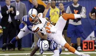 Cleveland Browns tight end Seth DeValve (87) is tackled by Indianapolis Colts free safety Malik Hooker (29) during the first half of an NFL football game in Indianapolis, Sunday, Sept. 24, 2017. (AP Photo/Darron Cummings)