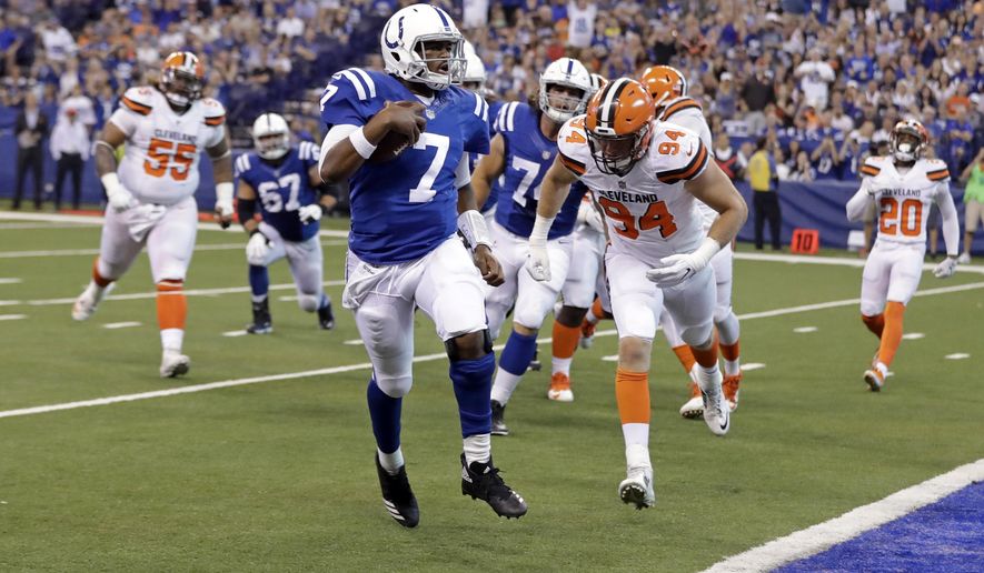 Indianapolis Colts quarterback Jacoby Brissett (7) runs in for a touchdown in front of Cleveland Browns defensive end Carl Nassib (94) during the first half of an NFL football game in Indianapolis, Sunday, Sept. 24, 2017. (AP Photo/Darron Cummings)
