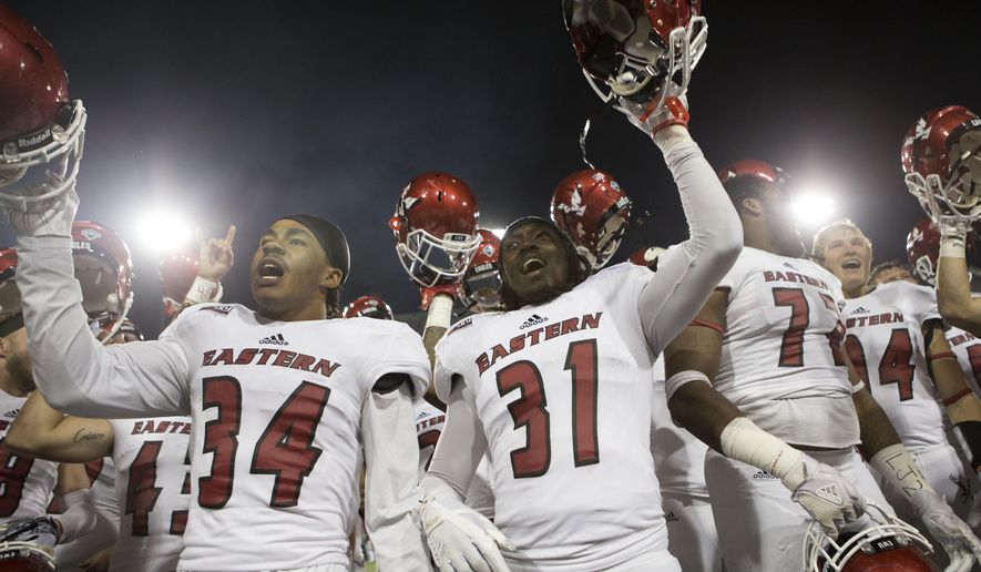Eastern Washington players sing the fight song to their fans after playing Montana in an NCAA college football game Saturday, Sept. 23, 2017, in Missoula, Mont. Eastern Washington won 48-41. (AP Photo/Patrick Record)
