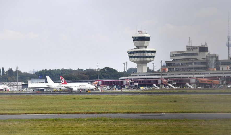 This Sept. 23, 2017 photo shows an overview of Tegel Airport in Berlin, Germany. During the German parliament election, Sunday, Sept. 24, 2017 Berlin residents are also called to decide on the future of Tegel airport. (Paul Zinken/dpa via AP)