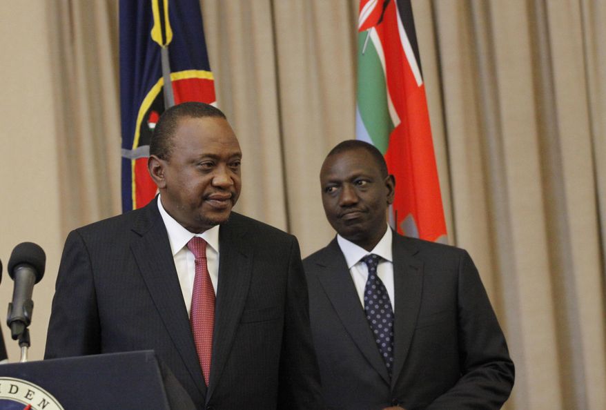 Kenya's President Uhuru Kenyatta, left, accompanied by Deputy President William Ruto, right, leaves after speaking to the media at State House in Nairobi, Kenya Thursday, Sept. 21, 2017. Kenya's electoral commission has announced it has moved the date for a fresh presidential election to Oct 26. The electoral commission had earlier set Oct 17 as the date for the fresh poll after the Supreme Court invalidated President Uhuru Kenyatta's August re-election and ordered a rerun within 60 days. (AP Photo/Khalil Senosi)