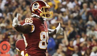 Washington Redskins tight end Vernon Davis (85) celebrates his touchdown during the first half of an NFL football game against the Oakland Raiders in Landover, Md., Sunday, Sept. 24, 2017. (AP Photo/Pablo Martinez Monsivais)
