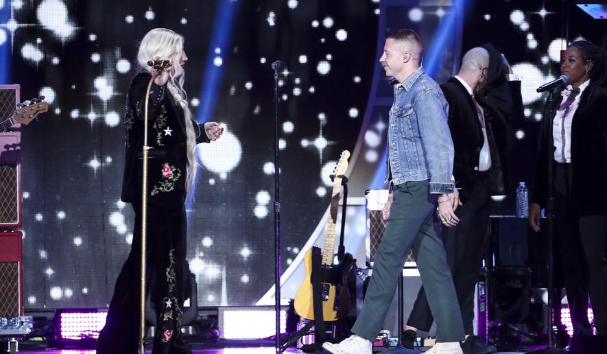 Kesha, left, and Macklemore perform at the 2017 iHeartRadio Music Festival Day 2 held at T-Mobile Arena on Saturday, Sept. 23, 2017, in Las Vegas. (Photo by John Salangsang/Invision/AP)