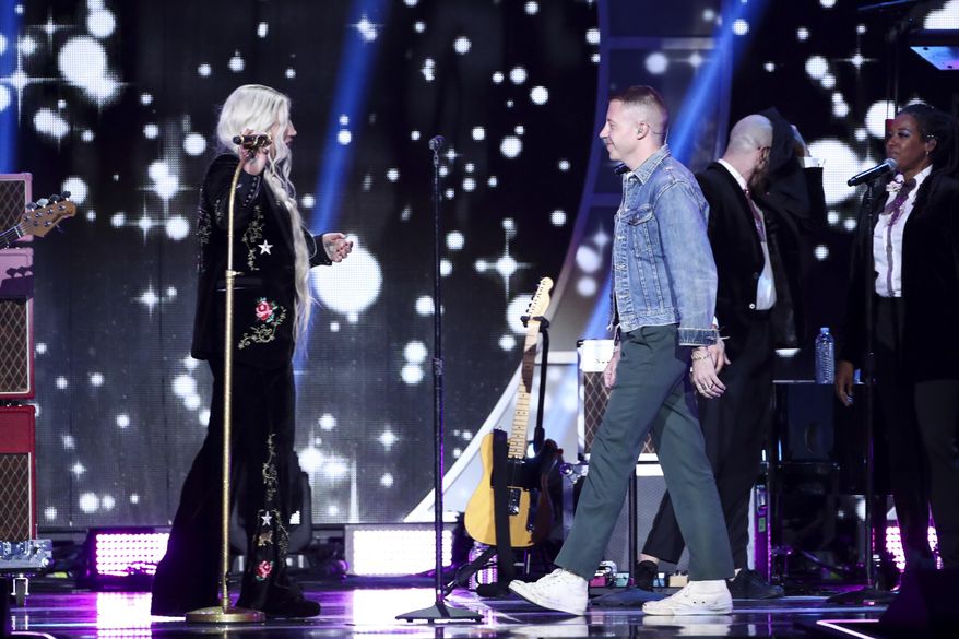 Kesha, left, and Macklemore perform at the 2017 iHeartRadio Music Festival Day 2 held at T-Mobile Arena on Saturday, Sept. 23, 2017, in Las Vegas. (Photo by John Salangsang/Invision/AP)