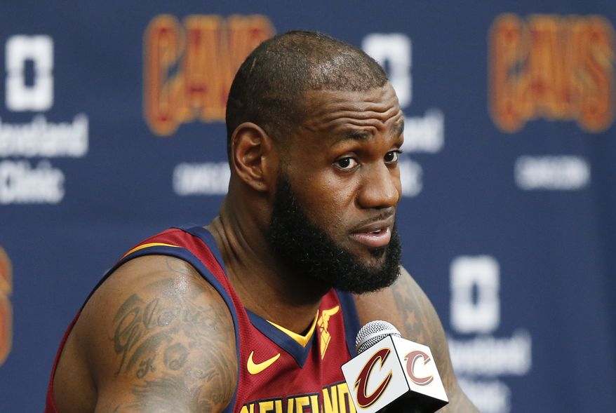 Cleveland Cavaliers' LeBron James answers questions during the NBA basketball team media day, Monday, Sept. 25, 2017, in Independence, Ohio. (AP Photo/Ron Schwane)