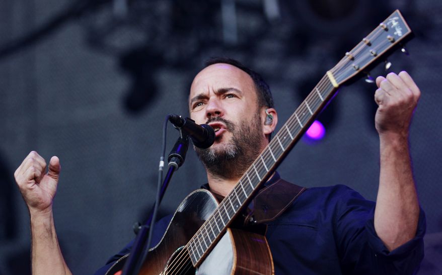 Dave Matthews delivers a speech at the start of the show after performing a solo song Sunday, Sept. 24, 2017, in Charlottesville, Va. Thousands of people have packed a stadium for a concert intended to raise money for charity and promote unity in the aftermath of this summer's white nationalist rallies. Matthews, whose band got its start in the Virginia college town, hosted the Sunday show. (Zack Wajsgras/The Daily Progress/The Daily Progress via AP)
