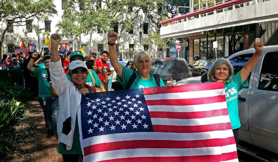 With immigrants and advocates chanting and beating drums outside, a federal appeals court heard arguments Friday on whether to allow a Texas law aimed at combating “sanctuary cities” to immediately take effect. On Monday, they upheld key parts of the law. (Associated Press/File)
