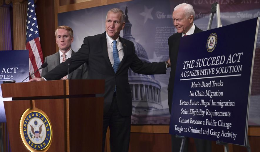 Sen. Thom Tillis, R-N.C., center, flanked by Sen. James Lankford, R-Okla., left, and Sen. Orrin Hatch, R-Utah, right, talk about the legislation they are introducing regarding the legal status of undocumented children during a news conference on Capitol Hill in Washington, Monday, Sept. 25, 2017. (AP Photo/Susan Walsh)