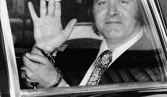 FILE – In this June 9, 1971, file photo, Edgar H. Smith Jr. waves his handcuffed hands as he leaves the federal house of detention in New York. Smith, a murder convict who got off New Jersey&#x27;s death row with the help of columnist William F. Buckley only to later confess to the crime, died in a California prison hospital. Smith died March 20, 2017, a spokesman for the California Department of Correction and Rehabilitation told The Associated Press on Monday, Sept. 25, 2017. He was 83. (AP Photo, File)