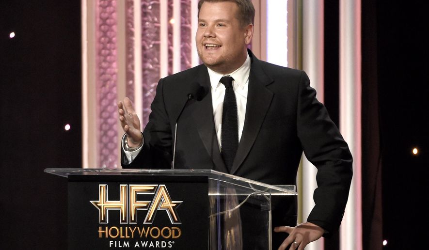 FILE - In this Nov. 6, 2016, file photo, host James Corden speaks at the 20th annual Hollywood Film Awards at the Beverly Hilton Hotel in Beverly Hills, Calif. Dick Clark Productions announced on Sept. 25, 2017, that Corden will return to host a third straight year when the awards are handed out on Nov. 5, 2017. (Photo by Chris Pizzello/Invision/AP, File)