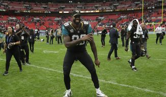 Jacksonville Jaguars tight end Marcedes Lewis (89) dances as he leaves the field after an NFL football game between the Jaguars and the Baltimore Ravens at Wembley Stadium in London, Sunday Sept. 24, 2017. The Jaguars won the match 44-7. (AP Photo/Matt Dunham)