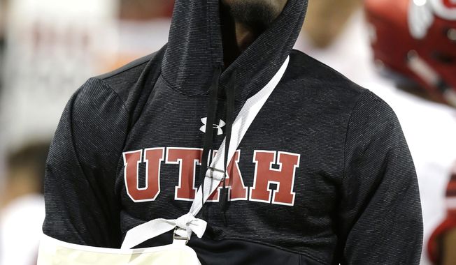 Utah quarterback Tyler Huntley watches from the side line after getting injured in the first half during an NCAA college football game against Arizona, Friday, Sept. 22, 2017, in Tucson, Ariz. Utah defeated Arizona 30-24. (AP Photo/Rick Scuteri)