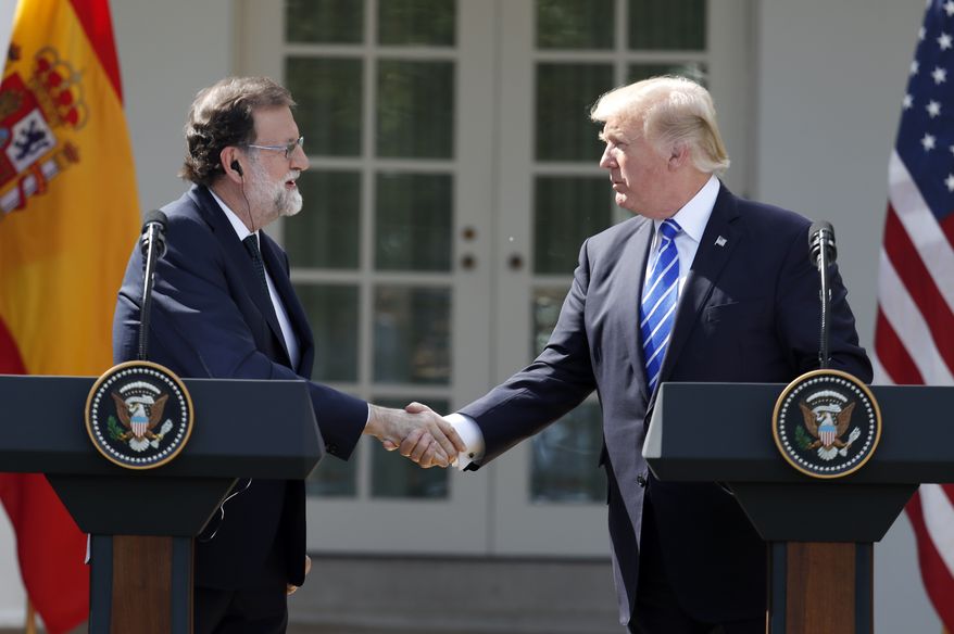 President Donald Trump shakes hands during a news conference with Spanish Prime Minister Mariano Rajoy in the Rose Garden of the White House, Tuesday, Sept. 26, 2017, in Washington. (AP Photo/Alex Brandon)