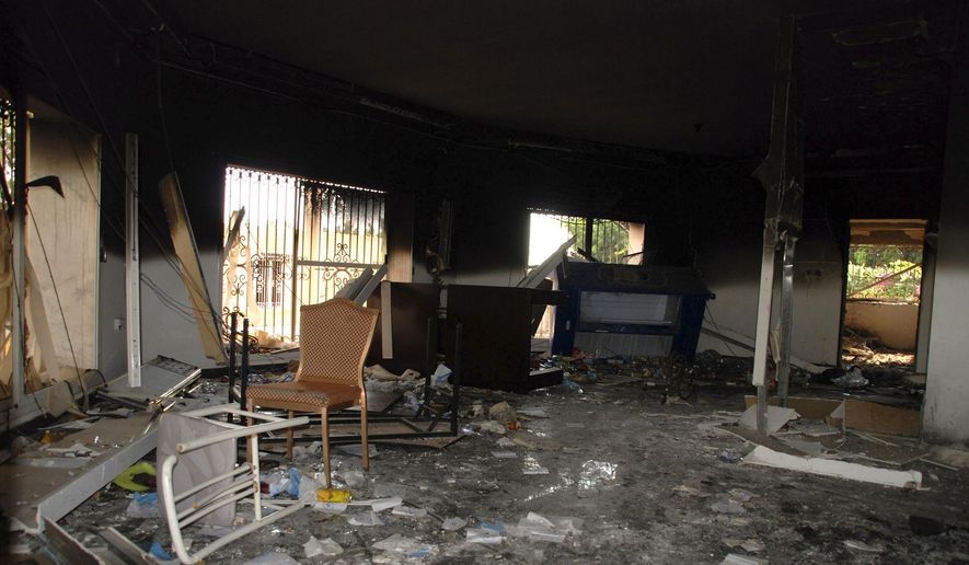 This Sept. 12, 2012, file photo shows glass, debris and overturned furniture are strewn inside a room in the gutted U.S. Consulate in Benghazi, Libya, after an attack that killed four Americans, including Ambassador Chris Stevens. (AP Photo/Ibrahim Alaguri, File)
