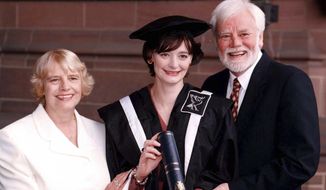 FILE - In this July 15, 1997 file photo, Cherie Booth with her parents Gale and Tony Booth after receiving an honorary fellowship from John Moore&#x27;s University in Liverpool, England. British actor Tony Booth, father-in-law of former Prime Minister Tony Blair, has died aged 85. Booth&#x27;s family says he died late Monday, Sept. 25, 2017 after suffering from Alzheimer&#x27;s disease and heart problems. Booth had his most enduring role as the left-wing son-in-law of a bigoted father in the sitcom &amp;quot;Till Death Us Do Part.&amp;quot; The show ran for almost a decade from 1966 and inspired the American series &amp;quot;All in the Family.&amp;quot; (Peter Wilcock/PA via AP, file)