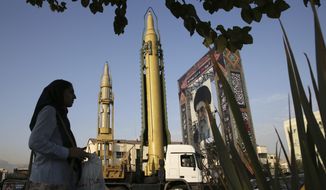 A Ghadr-H missle, center, a solid-fuel surface-to-surface Sejjil missile and a portrait of the Supreme Leader Ayatollah Ali Khamenei are on display for the annual Defense Week, marking the 37th anniversary of the 1980s Iran-Iraq war, at Baharestan Sq. in Tehran, Iran, Sunday, Sept. 24, 2017. Iran&#39;s elite Revolutionary Guard displayed the country&#39;s sophisticated Russian-made S-300 air defense system in public for the first time. (AP Photo/Vahid Salemi)