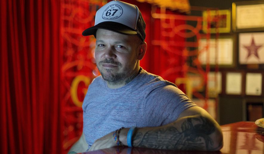 FILE - In this June 16, 2017 photo, file photo, singer-songwriter Rene Perez Joglar, also known as Residente, poses for a photo during an interview in Mexico City. Residente leads Latin Grammys nominations with nine nods that include record, song and album of the year. The Latin Recording Academy announced its nominees Tuesday, Sept. 26. (AP Photo/Eduardo Verdugo, File)