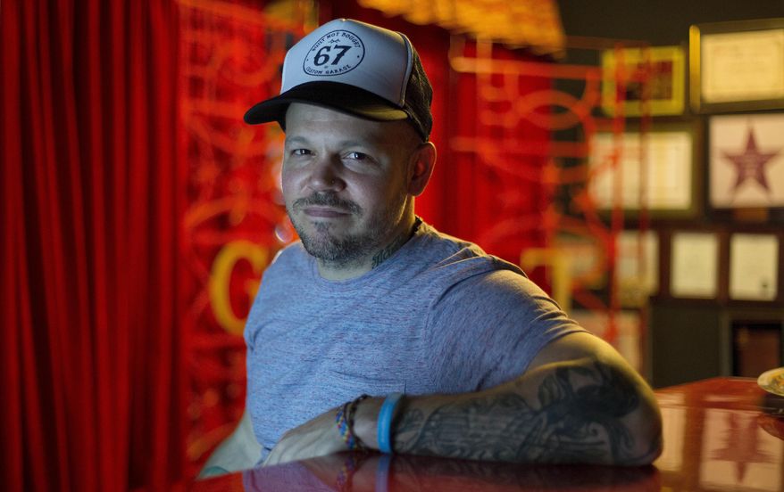 FILE - In this June 16, 2017 photo, file photo, singer-songwriter Rene Perez Joglar, also known as Residente, poses for a photo during an interview in Mexico City. Residente leads Latin Grammys nominations with nine nods that include record, song and album of the year. The Latin Recording Academy announced its nominees Tuesday, Sept. 26. (AP Photo/Eduardo Verdugo, File)